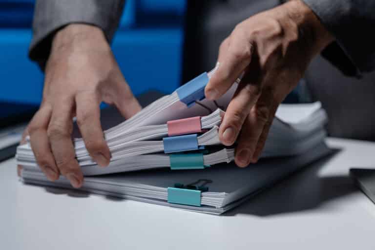 Yeni Meslek Standardı- Ölçme ve Değerlendirme Uzmanı (Seviye 7) 4 an employee was tidying up a pile of documents pil 2025 01 16 22 49 08 utc