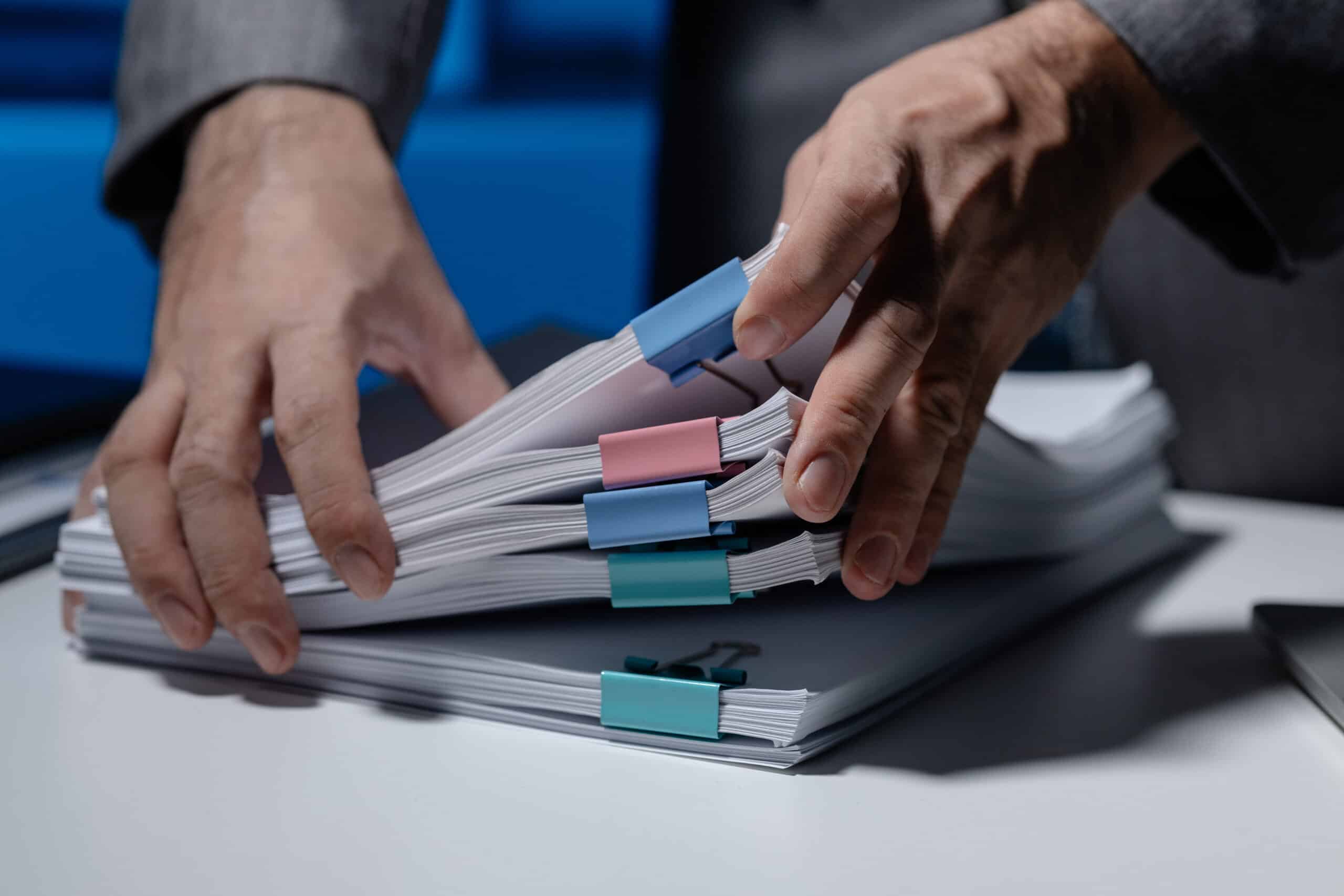 an employee was tidying up a pile of documents pil 2025 01 16 22 49 08 utc scaled