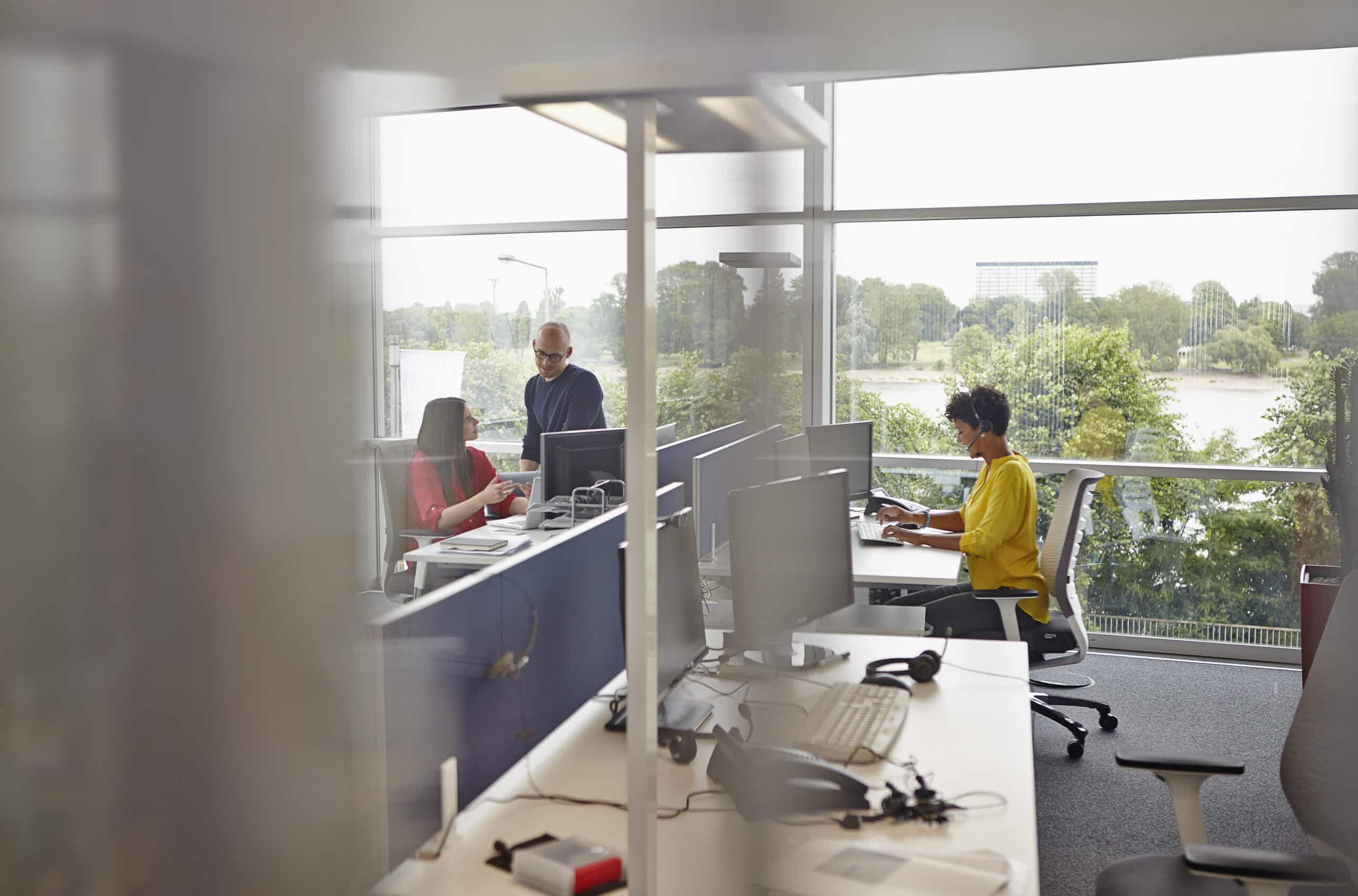 woman with headset working in open plan office 2024 09 22 22 49 58 utc scaled
